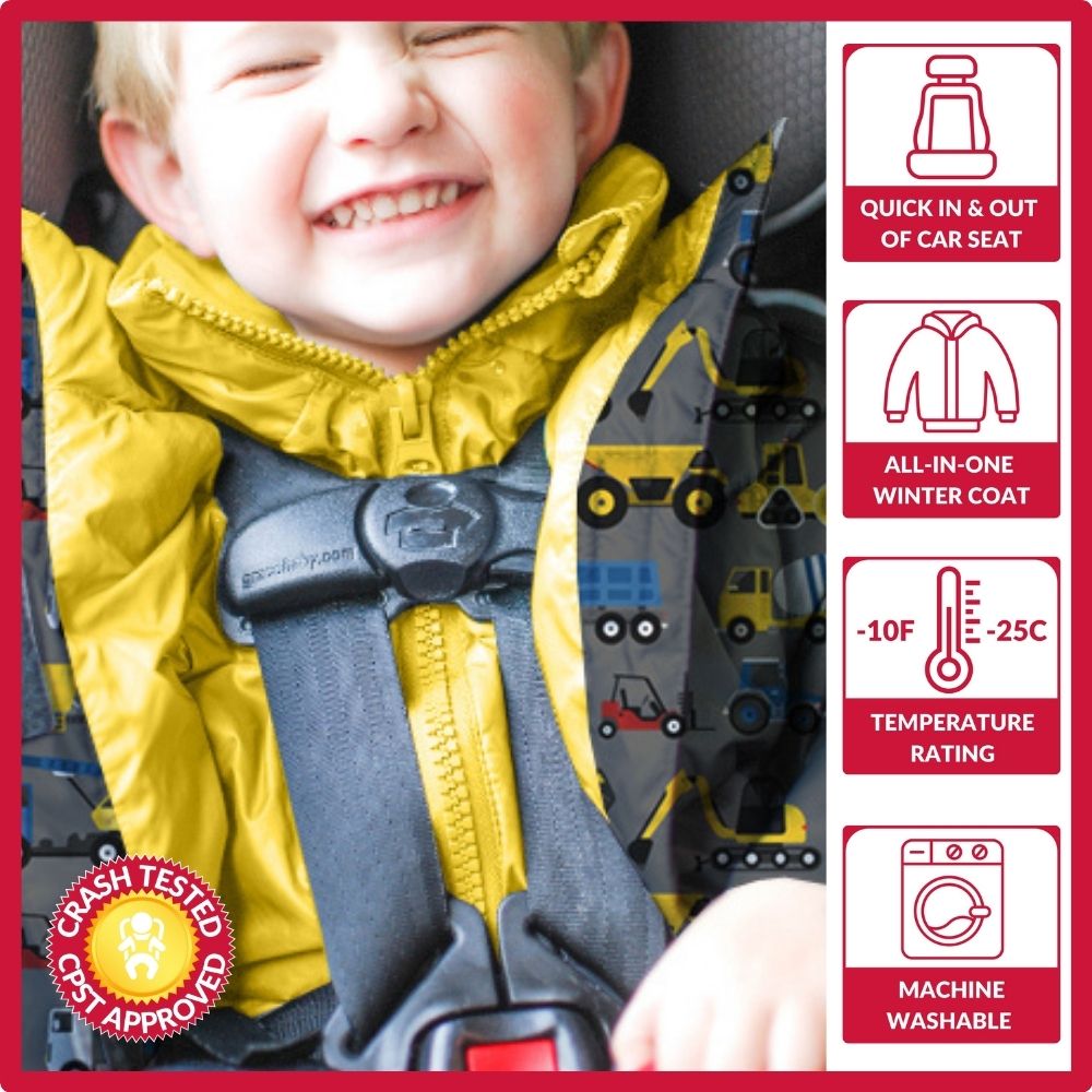 Boy in construction print Road Coat Vegan safely buckled in car seat – crash tested car seat coat