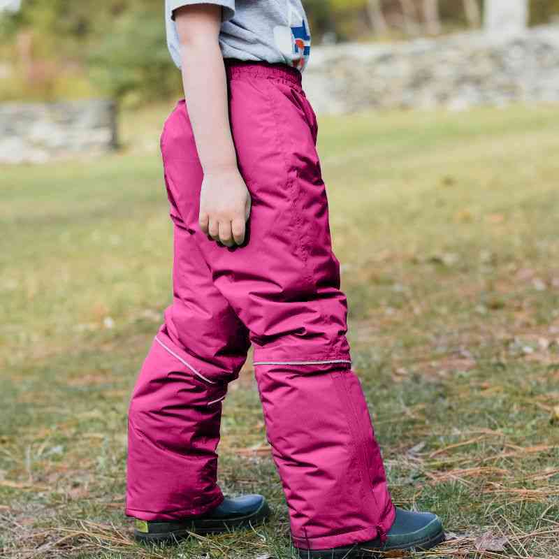 One Kid Arctic Pack-able Snow Pant – Fuchsia side view highlighting fully sealed seams, snow guard, and lightweight insulated fabric.